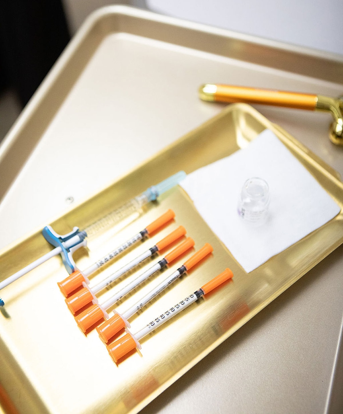 Medical syringes on a tray ready for use.