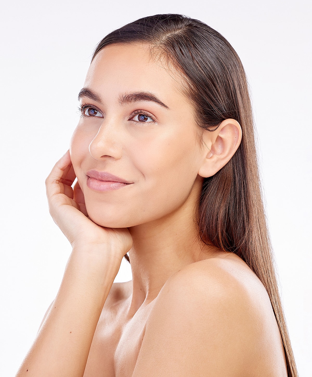 Woman with long hair and natural makeup.