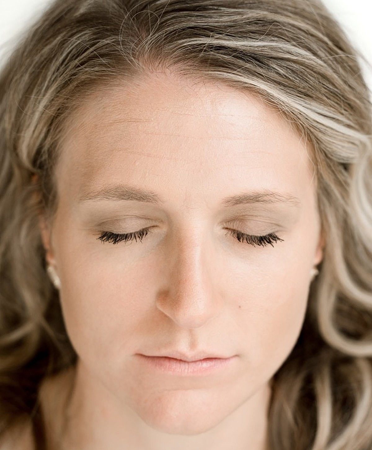 Woman with closed eyes, serene expression.