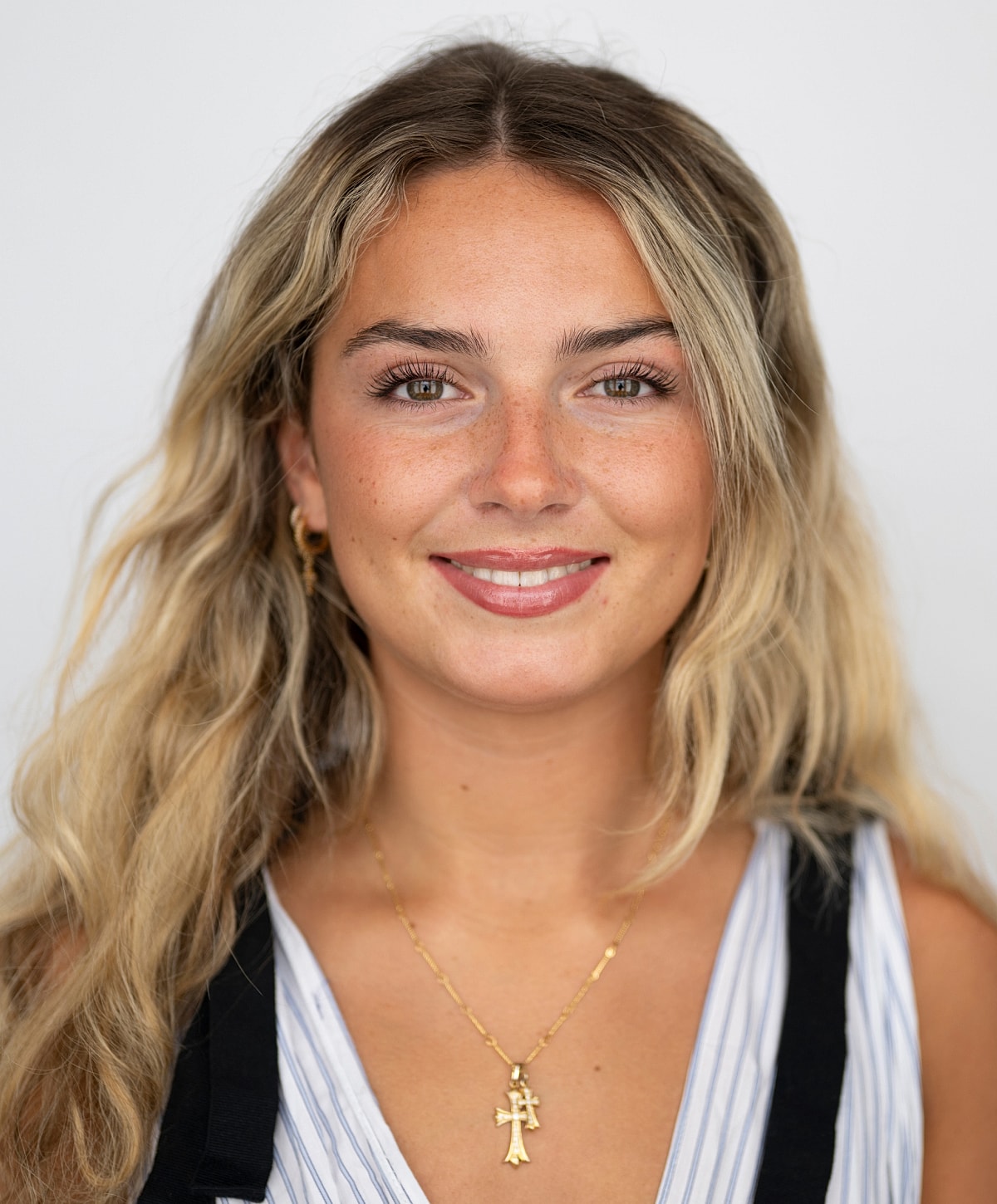 Portrait of a young woman with wavy hair.